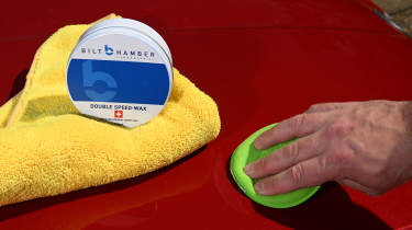 Auto Express products editor Tom Barnard waxing a Skoda Superb with Bilt-Hamber Double Speed-Wax